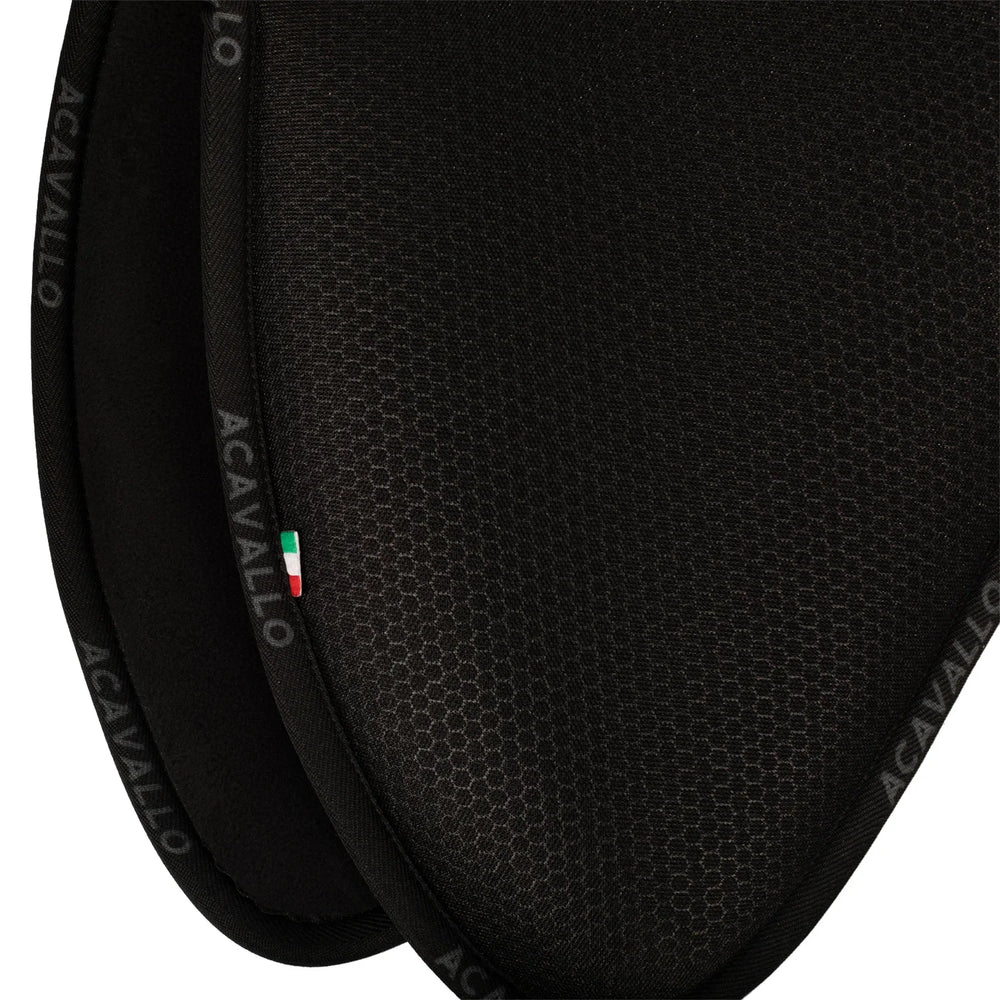 Close-up of a black equestrian saddle with 'Acavallo' branding.